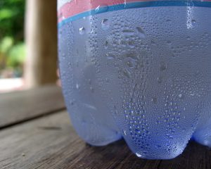 Condensation forming on cold soda bottle, an example 